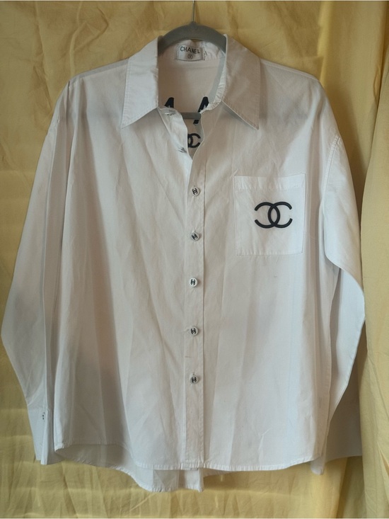 CHANEL Tops - CHANEL White Button-Up Shirt with Black CC Pocket Logo